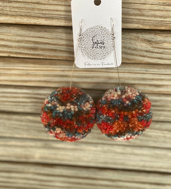 black pom pom earrings