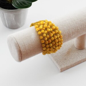 Bracelet manchette vintage en perles jaunes