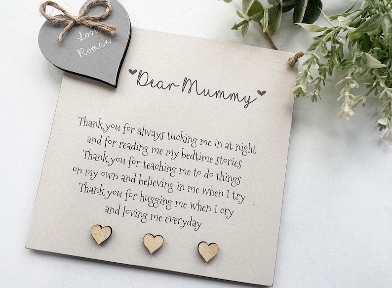 May include: A wooden sign with the text "Dear Mummy" and a sweet message of thanks for a mother's love. The sign is decorated with small wooden hearts.