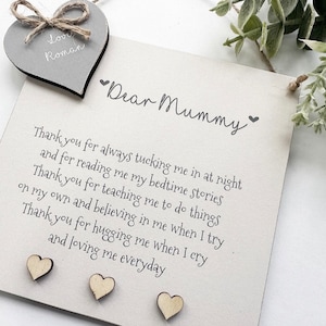May include: A white wooden sign with the text "Dear Mummy" and a sweet message of thanks for a mother's love and care. The sign is decorated with small wooden hearts.