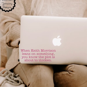 May include: A white laptop with a quote on the back that reads "When Keith Morrison leans on something, you know the plot is about to thicken."