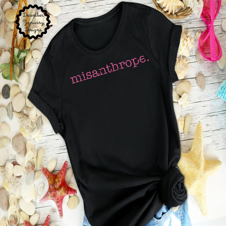 May include: Black t-shirt with the word "misanthrope" printed in pink on the front.