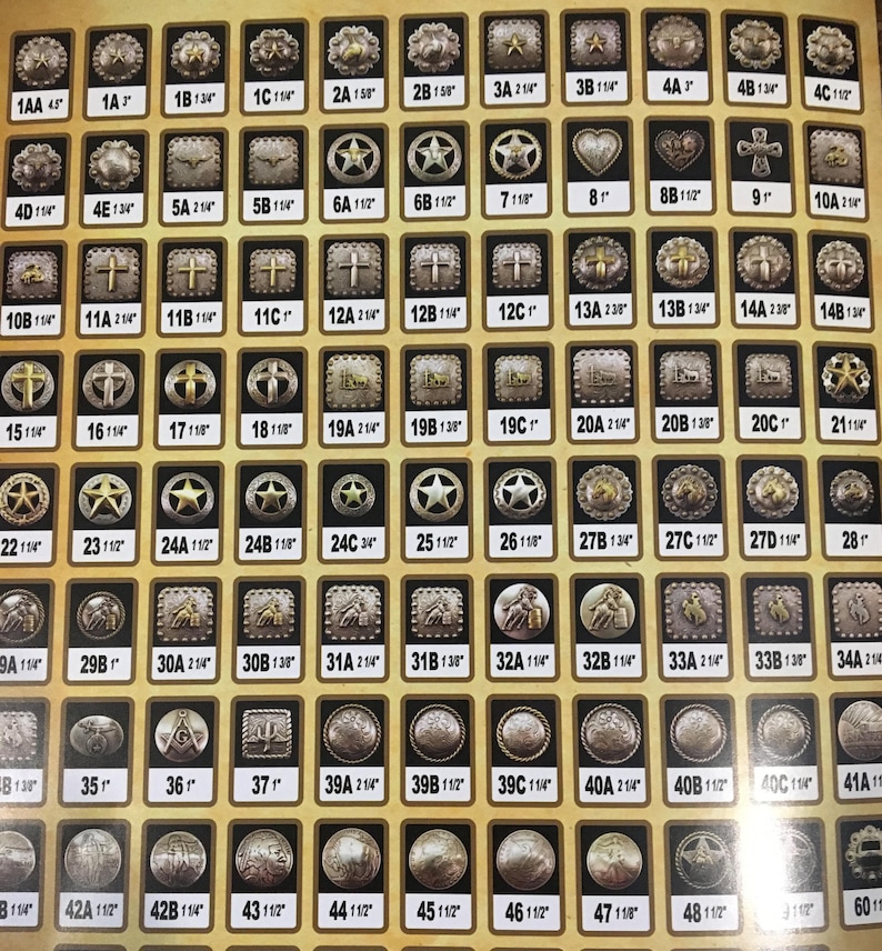 May include: A collection of silver and gold metal belt buckles with various designs, including stars, crosses, hearts, and horseshoes. The buckles are arranged in rows and columns on a yellow background. Each buckle has a letter and number designation.