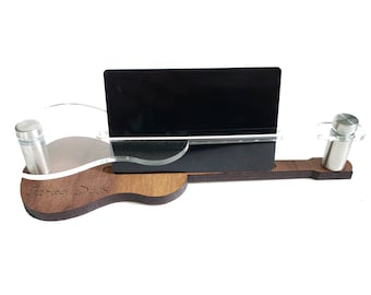 May include: A wooden guitar-shaped business card holder with a clear acrylic card slot and two stainless steel standoffs. The holder is engraved with the text "Three Day".
