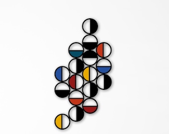 May include: Abstract wall art featuring a cluster of interconnected, semi-circular shapes in black, white, red, yellow, blue, and teal. The artwork is mounted on a white wall above a mustard-colored sofa, creating a modern aesthetic.