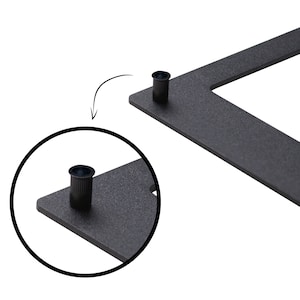 May include: Close-up of a black metal frame with two small black plastic caps. The caps are used to attach the frame to a wall.