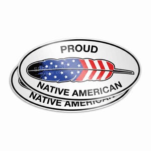 May include: An oval sticker featuring a central graphic of a feather colored with the American flag pattern of blue with white stars and red and white stripes. The text PROUD is printed above the feather and NATIVE AMERICAN is printed below.