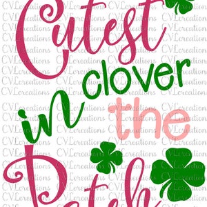 May include: Pink and green graphic design with the text "Cutest clover in the patch". The design features four-leaf clovers.