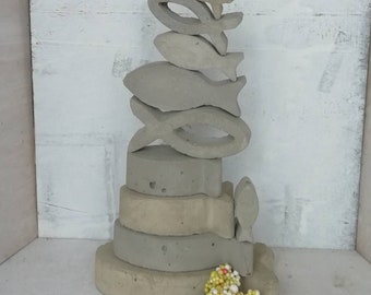 Concrete fish for table decorations for baptism