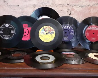 Vinyl Records for crafting, 7 Inch records. Packs of Twelve. six with and six without centres. Different Records Companies and colours.