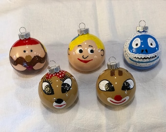 Rudolph the red nosed reindeer Christmas ornaments Sam the snowman Hermey the elf clarice yukon cornelius abominable snowman Santa Moonracer