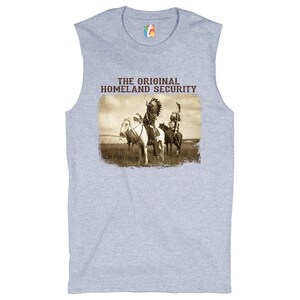 May include: A grey sleeveless t-shirt with a vintage image of two Native American men on horseback. The text "THE ORIGINAL HOMELAND SECURITY" is printed above the image.