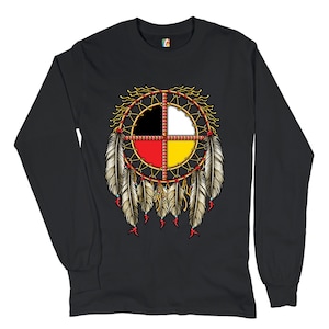 May include: Black long-sleeve t-shirt with a Native American dreamcatcher design featuring a circle with four colors: black, white, red, and yellow. The dreamcatcher has feathers hanging from the bottom.