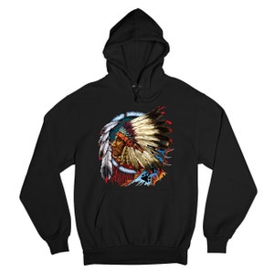 May include: Black hooded sweatshirt with a colorful graphic print of a Native American man wearing a headdress with feathers. The graphic is surrounded by a circle of feathers and other designs.