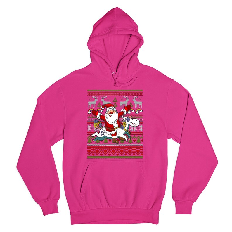 May include: A pink hooded sweatshirt with a Christmas-themed design featuring Santa Claus riding a unicorn. The design includes a festive pattern of snowflakes, reindeer, and hearts.