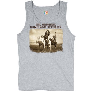 May include: A gray tank top with a vintage-style image of two Native American men on horseback. The text "THE ORIGINAL HOMELAND SECURITY" is printed above the image.