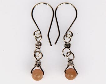 Sunstone dangle earrings with sterling silver wire wrap and hypoallergenic surgical steel ear wires