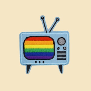 May include: An embroidered patch depicting a vintage television with a rainbow screen.