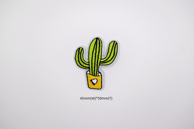May include: Green embroidered cactus patch with a yellow pot and a white heart. The patch is 45mm wide and 50mm tall.
