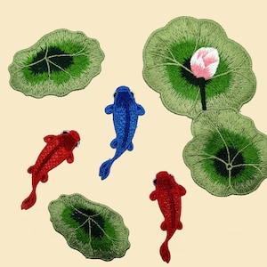 May include: Five embroidered iron-on patches featuring a blue and two red koi fish and two green lily pads, one with a pink flower bud.