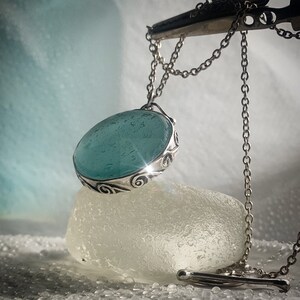 Custom made Genuine seaglass open back pendant in sterling silver. Can be custom coloured.