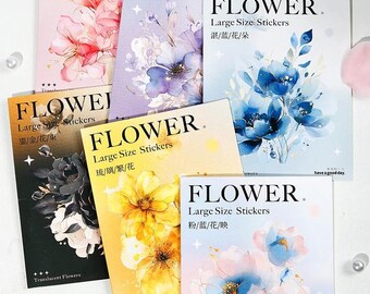 May include: A collection of six rectangular sticker packs labeled FLOWER Large Size Stickers. Each pack features watercolor-style floral illustrations in distinct color palettes including pink, purple, blue, black, yellow, and a soft gradient blend.