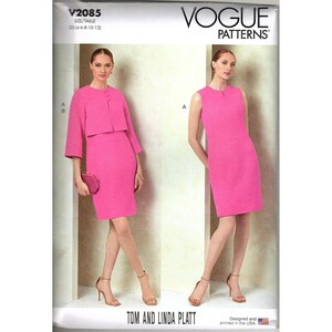 May include: Vogue Patterns sewing pattern featuring a pink dress and jacket ensemble. The pattern includes a sleeveless dress and a cropped jacket with three-quarter sleeves. The pattern is designed and printed in the USA.