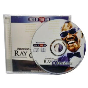 May include: A Ray Charles American Soul music CD in a clear plastic jewel case. The disc features a portrait of Ray Charles wearing sunglasses and a bowtie. The cover and disc display the text Music of Your Life, American Soul, and Ray Charles.