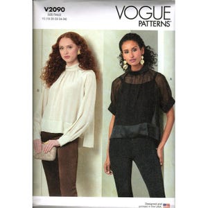 May include: Vogue Patterns V2090 sewing pattern envelope featuring two blouse designs. One is a long-sleeved cream high-neck blouse, and the other is a short-sleeved black sheer high-neck blouse with a solid underlayer. The text V2090 and VOGUE PATTERNS are visible.