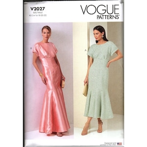 May include: Vogue Patterns sewing pattern featuring two elegant dresses. One is a floor-length, pink satin gown with a mermaid silhouette. The other is a knee-length, green and white patterned dress with a flared hem. The pattern number is V2027.