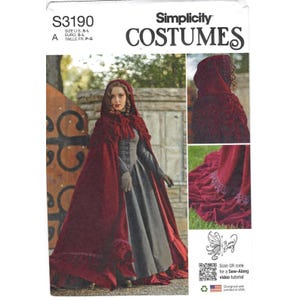 May include: Simplicity Costumes pattern S3190 for a floor-length, deep red velvet hooded cape with ruffled trim. The pattern envelope displays the cape worn over a grey dress, with additional views of the hood and the hemline with lace detail.