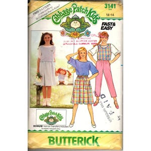 May include: A vintage Butterick sewing pattern for Cabbage Patch Kids outfits. The pattern features illustrations of girls wearing various outfits, including a skirt, top, and pants. The pattern size is 12-14.