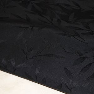 Solid black polyester upholstery fabric coupon with foliage image 2