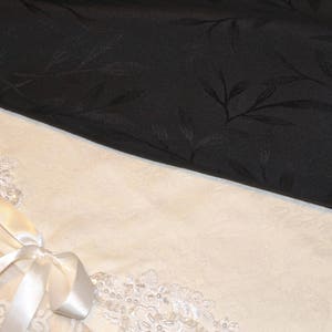 Solid black polyester upholstery fabric coupon with foliage image 1