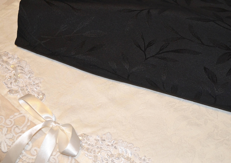 Solid black polyester upholstery fabric coupon with foliage image 1