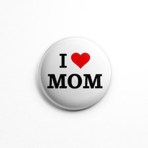 May include: White button with black text that reads "I love MOM" with a red heart in place of the "O".