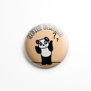 May include: A round button with a light brown background. The text "YOUR DESIGN" is written in white on the top of the button. A black and white cartoon panda bear with a confused expression is in the center of the button. The panda bear has two question marks above its head.