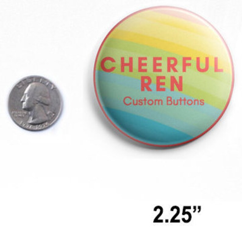 May include: A 2.25 inch round button with a rainbow striped background. The text "CHEERFUL REN Custom Buttons" is printed in red on the button.