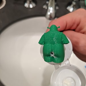 Shrek pooping toothpaste topper image 3