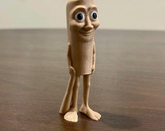 May include: A 3D printed figurine of a cartoon character with a long, slender body, large eyes, and a wide smile. The figurine is made of a light brown plastic and has a textured surface.