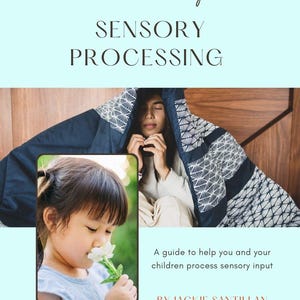 May include: A book cover with the title "Neurodivergent Sensory Processing." The cover features a photo of a person under a patterned blanket and a child smelling a flower. Text reads "A guide to help you and your children process sensory input."
