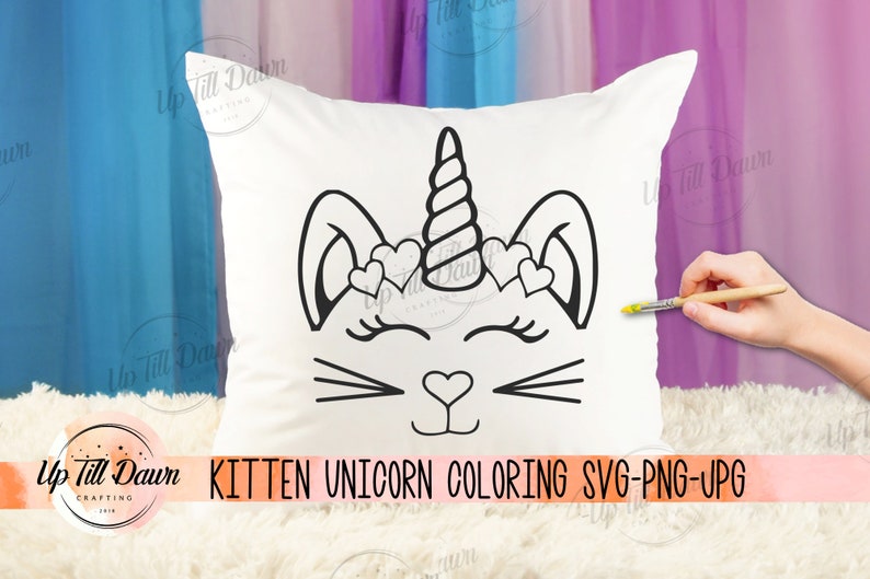 May include: White pillow with a black kitten unicorn design. The design includes a unicorn horn, heart-shaped accents, and a cat face. The text "Kitten Unicorn Coloring SVG-PNG-JPG" is displayed at the bottom.
