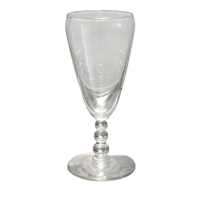 May include: A clear glass goblet featuring a smooth, tapered bowl and a stem composed of three stacked, spherical glass beads, resting on a circular, flat base. The entire piece is constructed from transparent, colourless glass material.