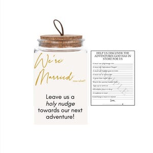 May include: A clear glass jar with a cork lid and a brown loop, featuring a label that reads We're Married now what? Leave us a holy nudge towards our next adventure! Next to it is a card titled HELP US DISCOVER THE ADVENTURES GOD HAS IN STORE FOR US.