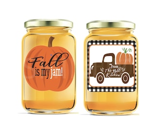 May include: Two glass jars with labels. The jar on the left has a label with a pumpkin and the text "Fall is my jam!" The jar on the right has a label with a black and white checked background, a brown truck with a pumpkin on top, and the text "From The Hill Kitchen".