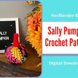 May include: A crochet pattern for a Sally Pumpkin from The Nightmare Before Christmas. The pattern is a digital download and is available for purchase. The image shows a crocheted Sally Pumpkin with a red stem and a black, yellow, and pink body.