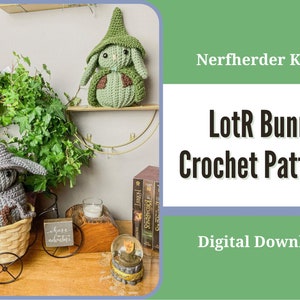 May include: A crochet pattern for a Lord of the Rings bunny, featuring a gray bunny in a brown hat and a green bunny in a green hat. The pattern is available as a digital download. Nerfherder Knits.