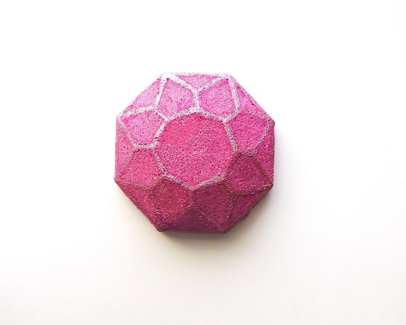 This is a gem of a bath bomb, an adventurous take on a traditional rose scent. With rose petals leading the way, a bright and unique blend of bergamot, orange zest, jasmine, and grapefruit, and undertones of sandalwood and musk.  This 4.5 oz bath bomb will turn the water into a deep