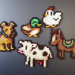 Various Stardew Valley fuse bead art/fridge magnets