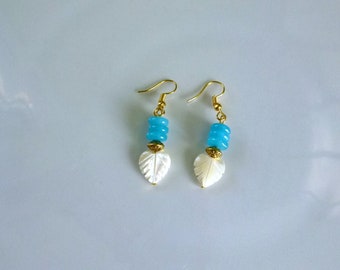 earrings with blue amazonite washers, white mother-of-pearl leaves and chiseled gold metal spinning top beads mounted on hooks